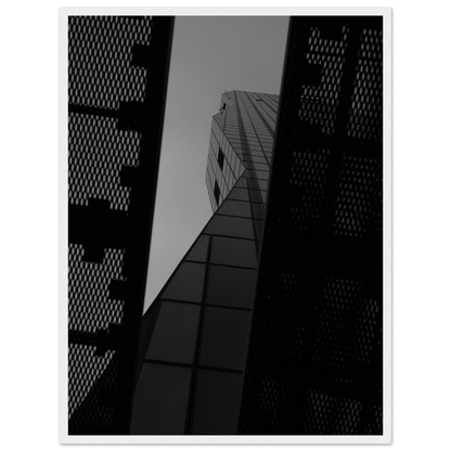 Black and white Low angle view looking up at a tall glass skyscraper framed between two metal structural elements on Wooden frame wall art