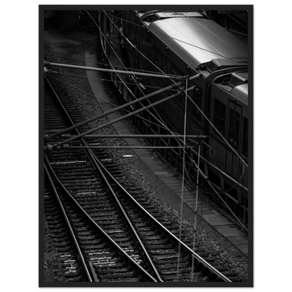 Black and white aerial view of metro train and railway tracks in an urban underground or elevated rail system on wooden framed wall art