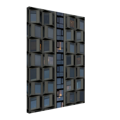 Close up view of a modern building facade with a grid of reflective glass windows on Canvas print wall art