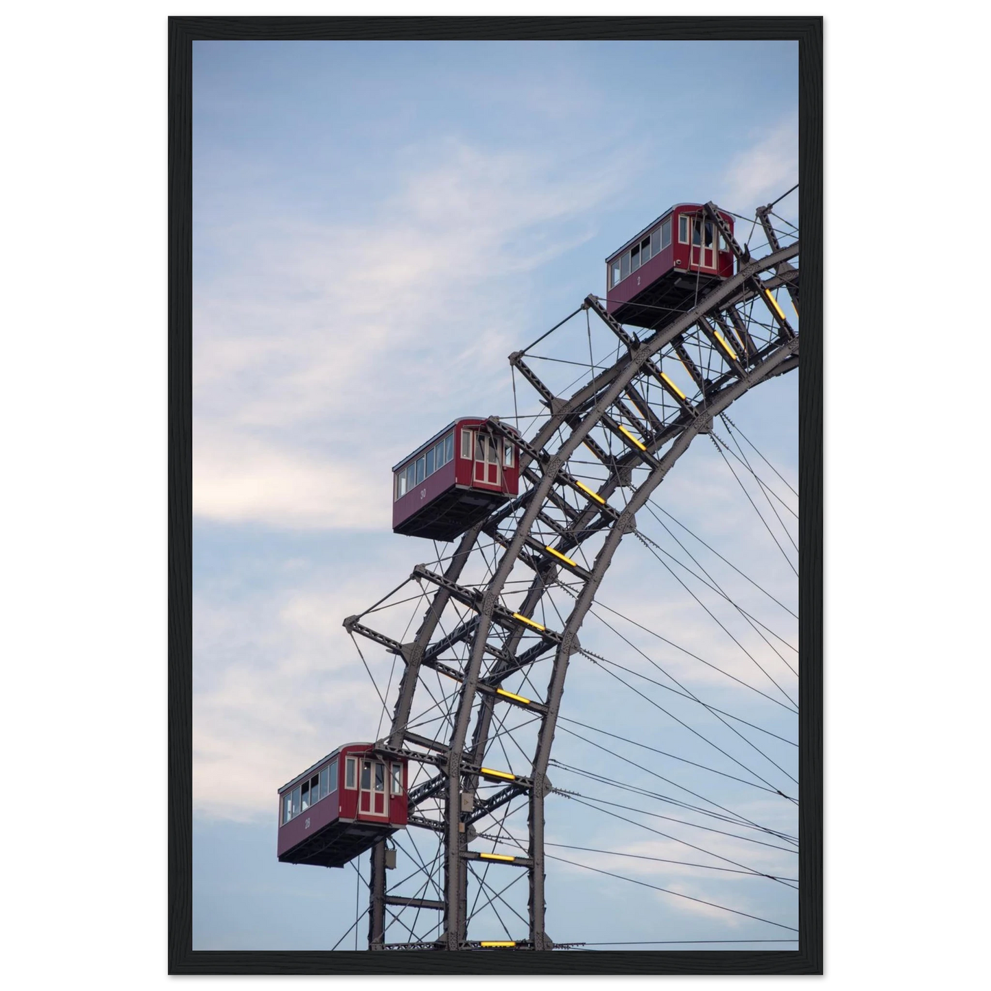 Close up of the historic Vienna Prater Giant Ferris Wheel (Wiener Riesenrad) showing its iconic steel structure and vintage mechanical details on wooden framed wall art