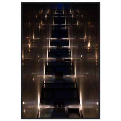 Low angle view looking up a narrow corridor-like passage between two skyscraper walls lined with rows of windows stretching toward the sky on wooden framed wall art