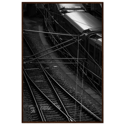 Black and white aerial view of metro train and railway tracks in an urban underground or elevated rail system on wooden framed wall art