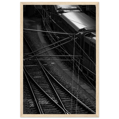Black and white aerial view of metro train and railway tracks in an urban underground or elevated rail system on wooden framed wall art