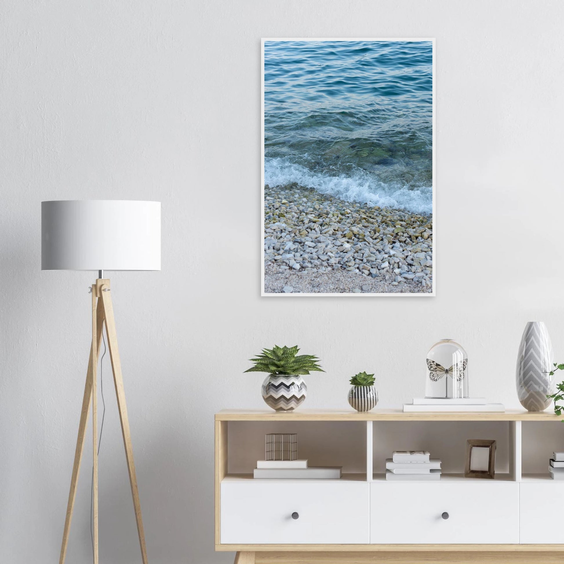 Aerial view ocean beach with wood frame, top down drone shot of blue sea foam and pebbles on the wall in the Livingroom