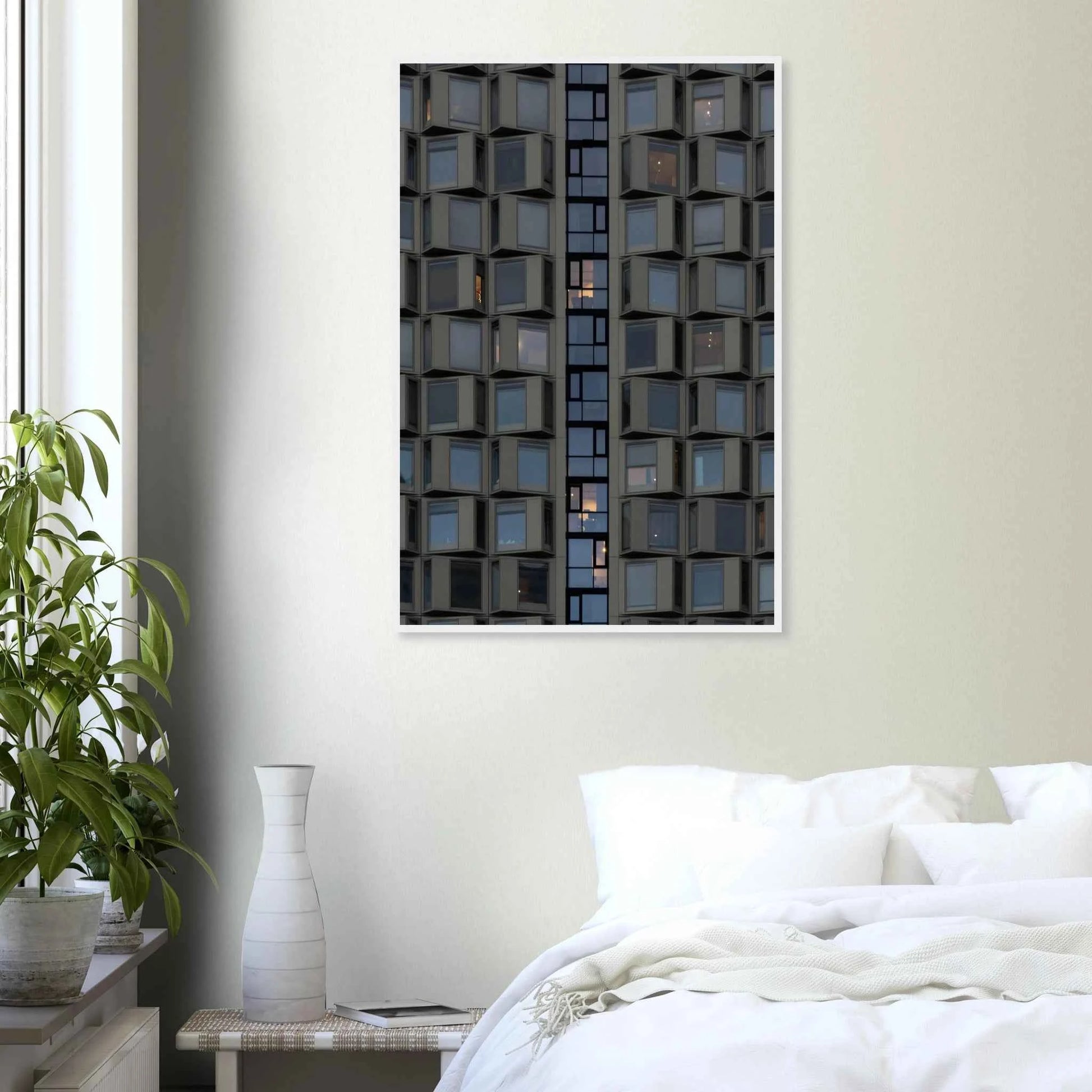 Close up view of a modern building facade with a grid of reflective glass windows on wooden frame wall art on the wall in the Bedroom