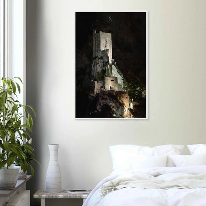 Wooden framed wall art of an ancient stone bastion decorated with green climbing plants against a dark background in Shadow Keep on the wall in the Bedroom