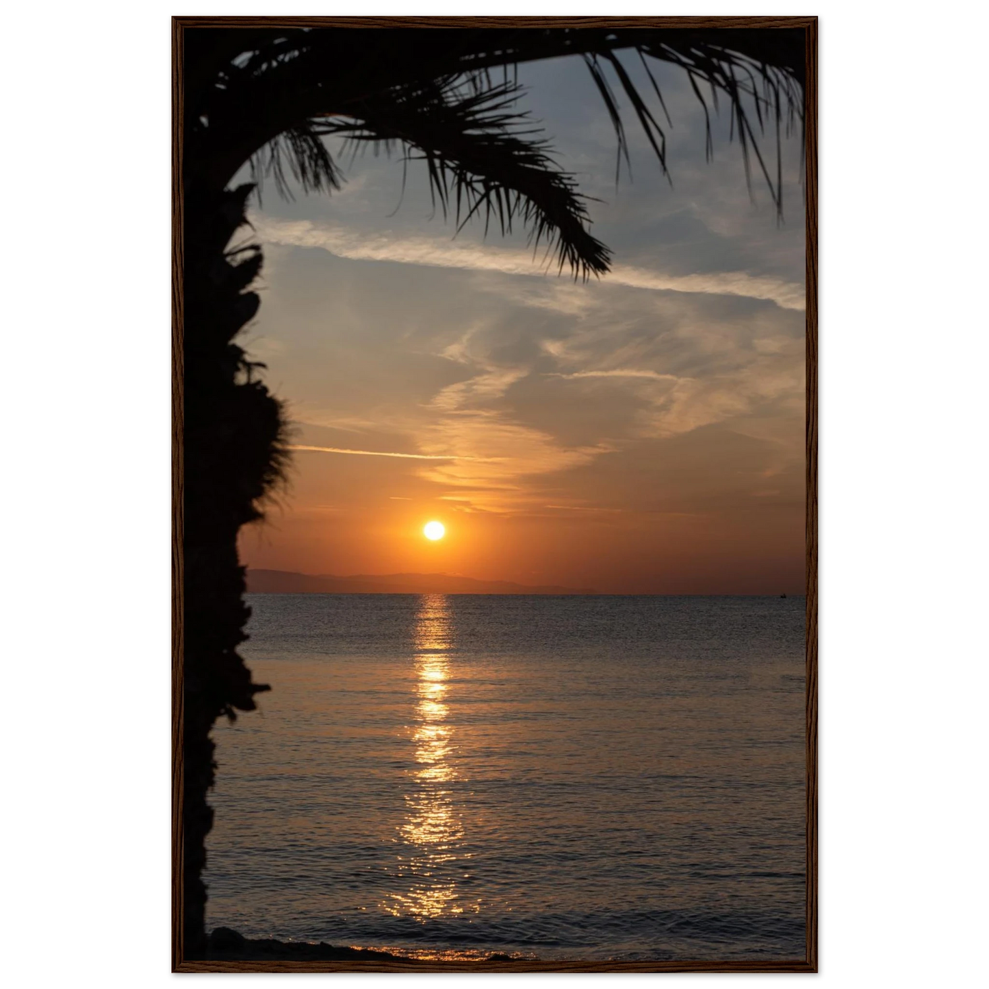 Wooden framed wall art Sunset over calm water with golden reflections, framed by tree branches in a peaceful natural landscape