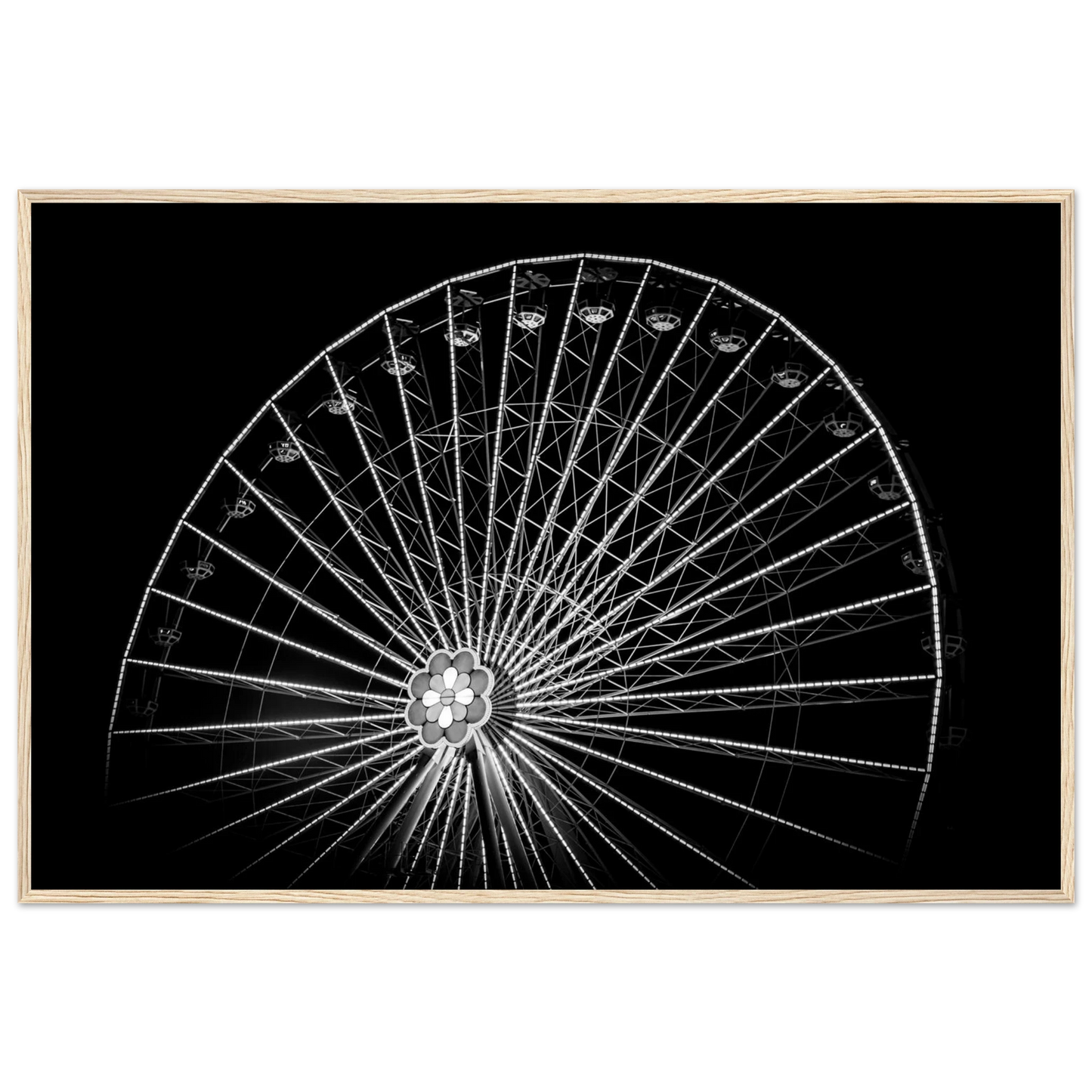 Black and white night photo of the Vienna Prater Giant Ferris Wheel (Wiener Riesenrad) with illuminated spokes forming a circular pattern against the dark sky on wooden framed wall art