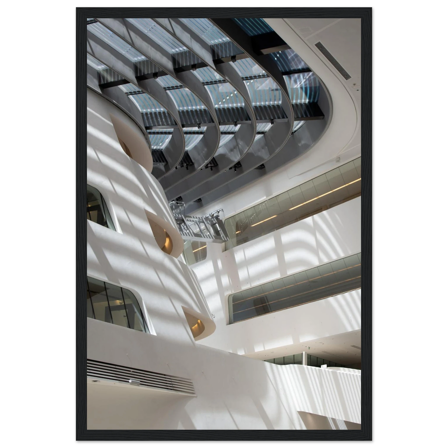 Interior view of the Library of WU (Vienna University of Economics and Business) on wooden frame wall art featuring modern architecture with multiple floors and open study spaces