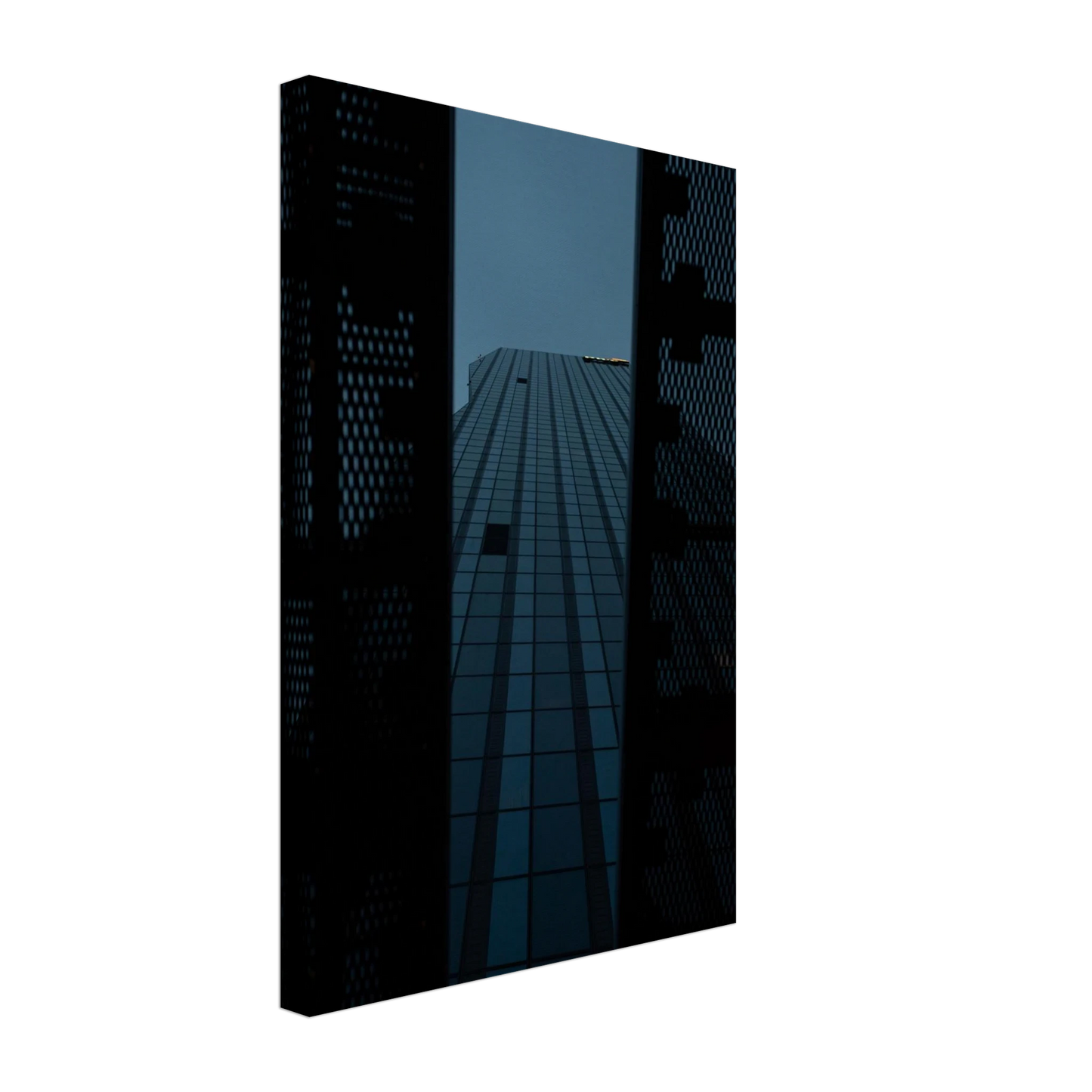 Low angle view looking up at a tall glass skyscraper framed between two metal structural elements on Canvas Print wall art