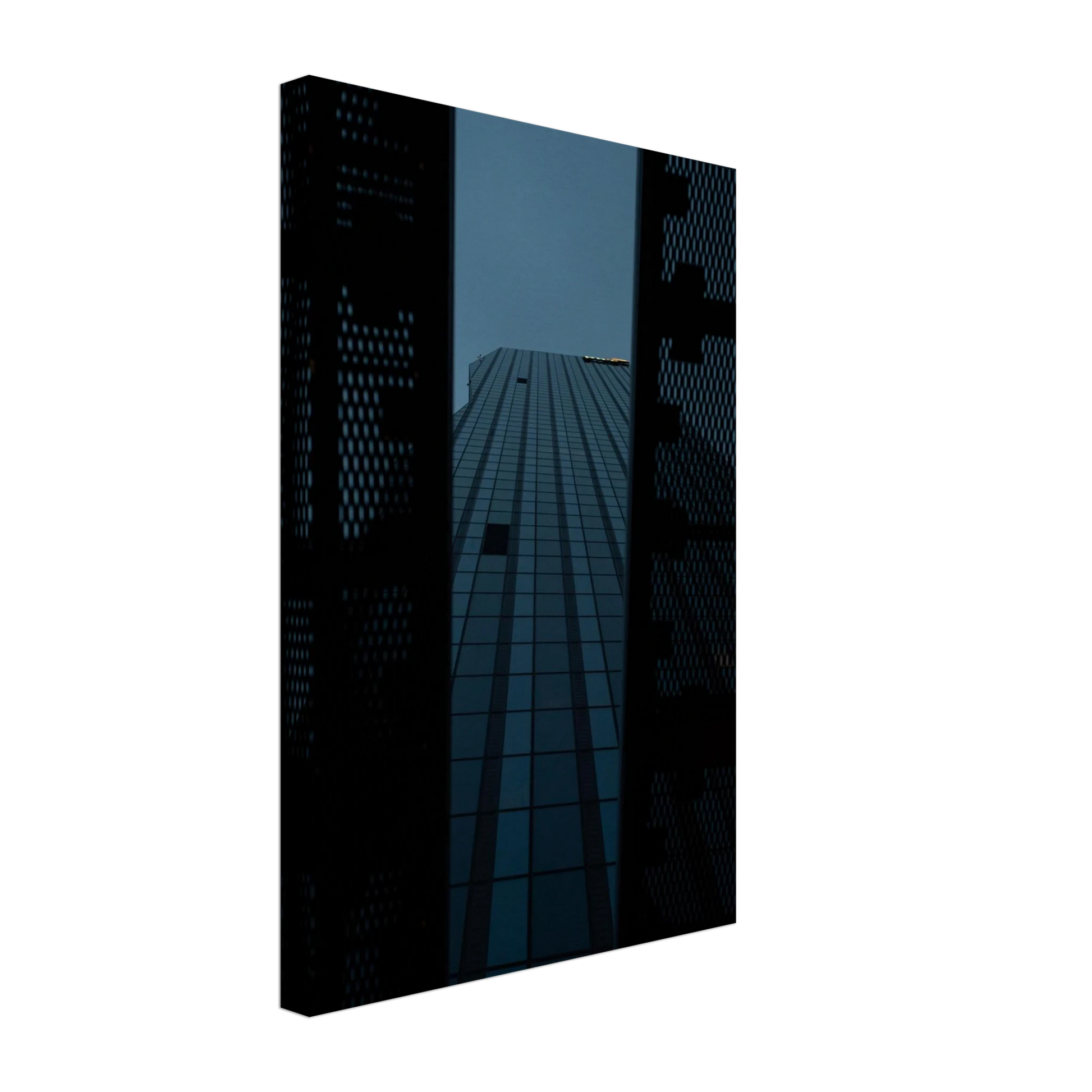 Low angle view looking up at a tall glass skyscraper framed between two metal structural elements on Canvas Print wall art