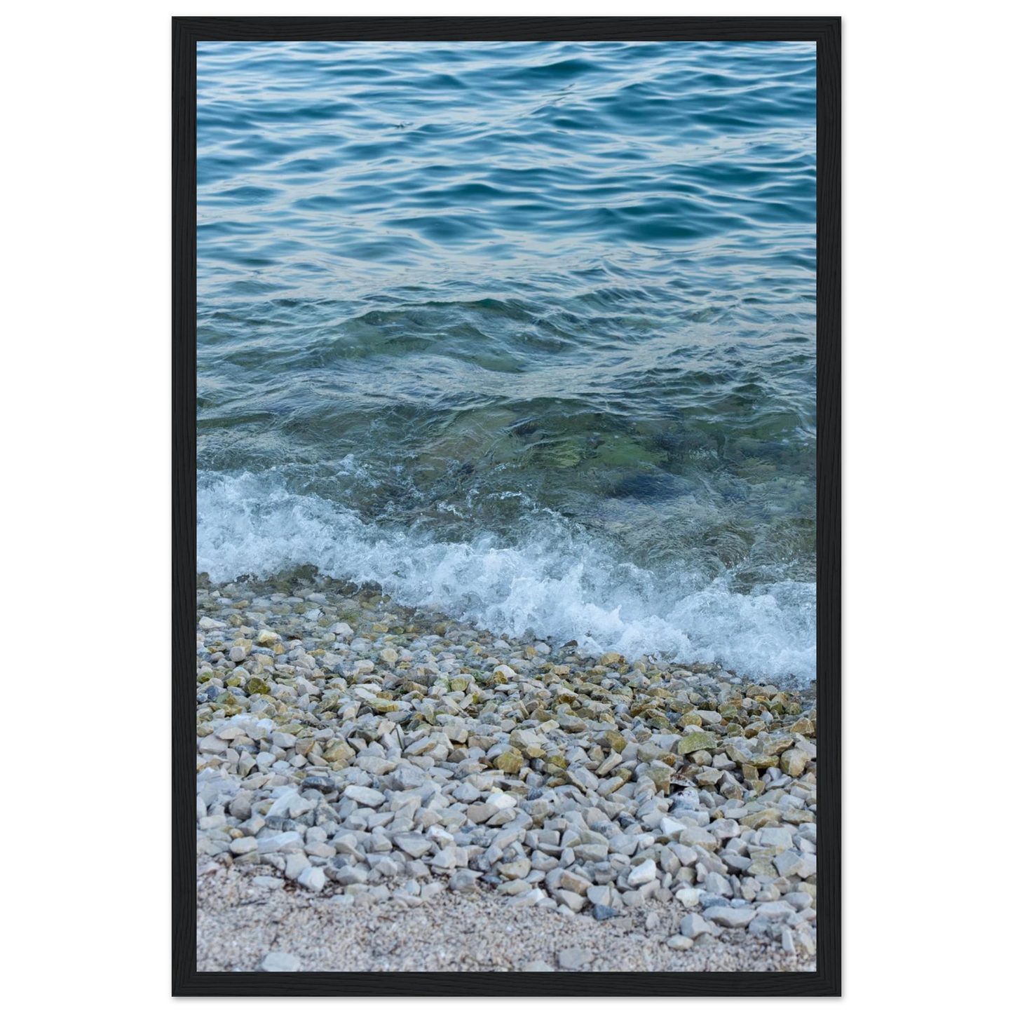 Aerial view ocean beach with wood frame, top down drone shot of blue sea foam and pebbles
