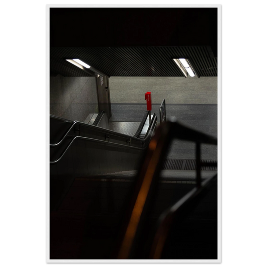 Nighttime view of a metro station entrance with illuminated signs and dark urban surroundings on wooden framed wall art