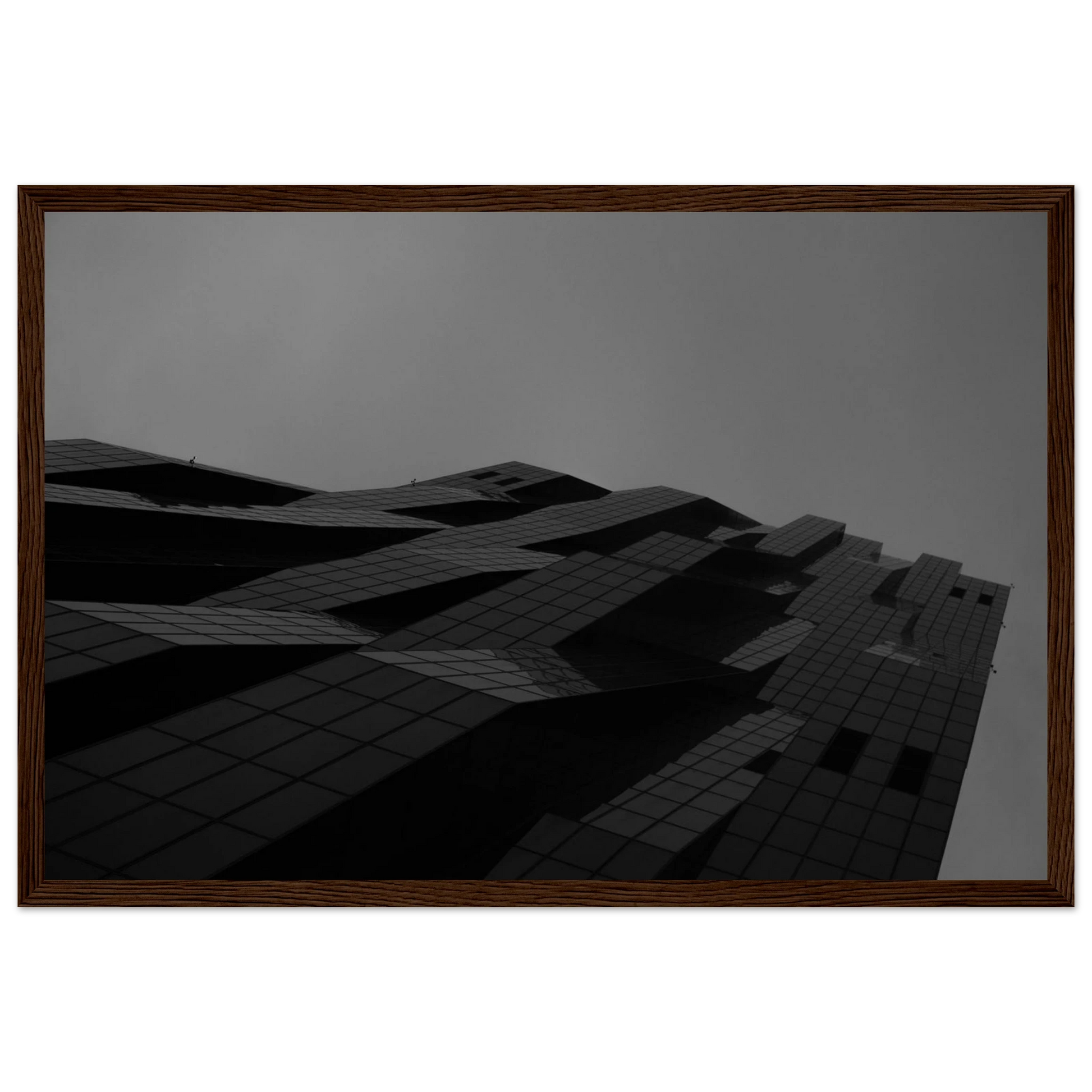 Black and white low angle view of a modern skyscraper with bold geometric lines and dark textured facade on wooden framed wall art