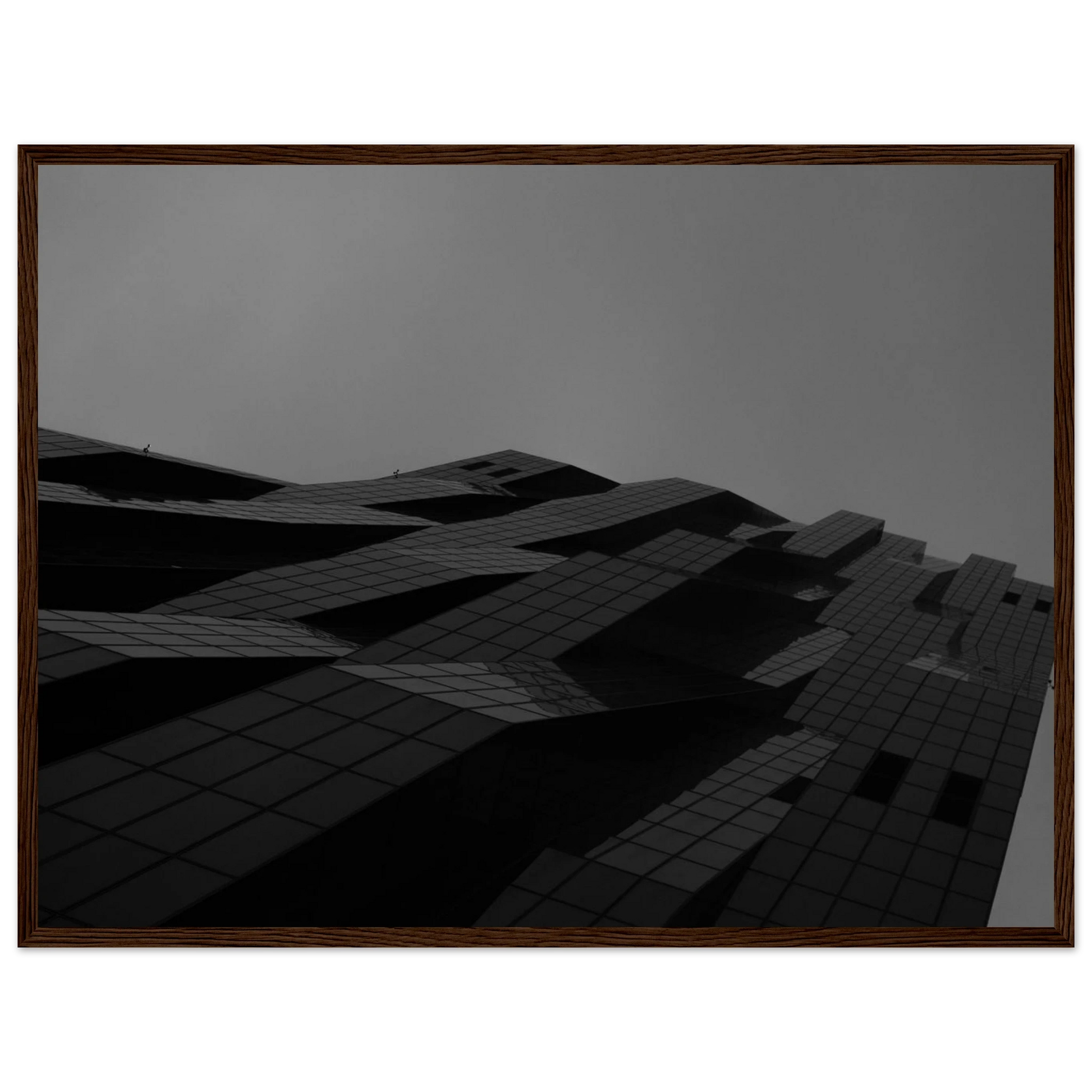 Black and white low angle view of a modern skyscraper with bold geometric lines and dark textured facade on wooden framed wall art