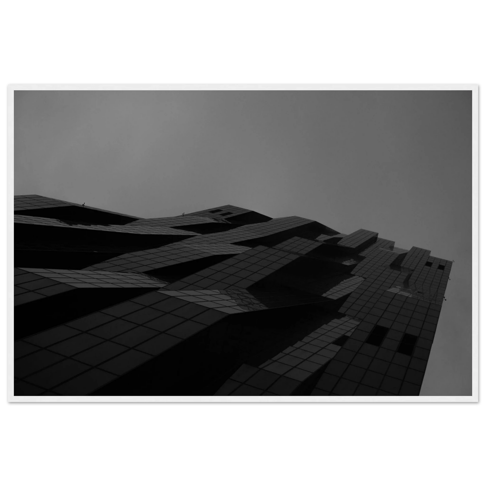 Black and white low angle view of a modern skyscraper with bold geometric lines and dark textured facade on wooden framed wall art