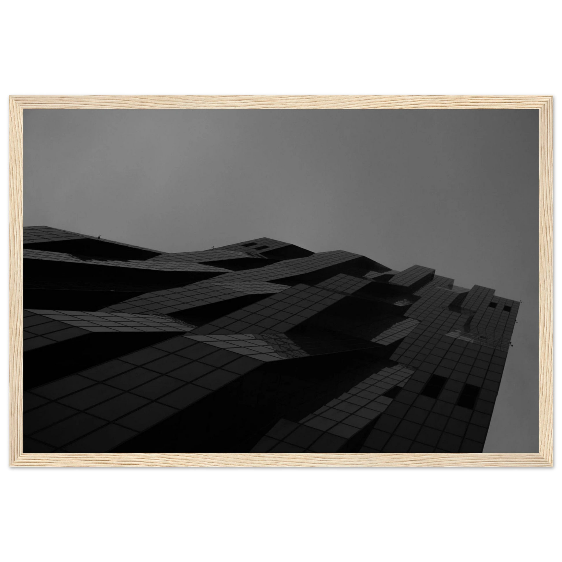 Black and white low angle view of a modern skyscraper with bold geometric lines and dark textured facade on wooden framed wall art