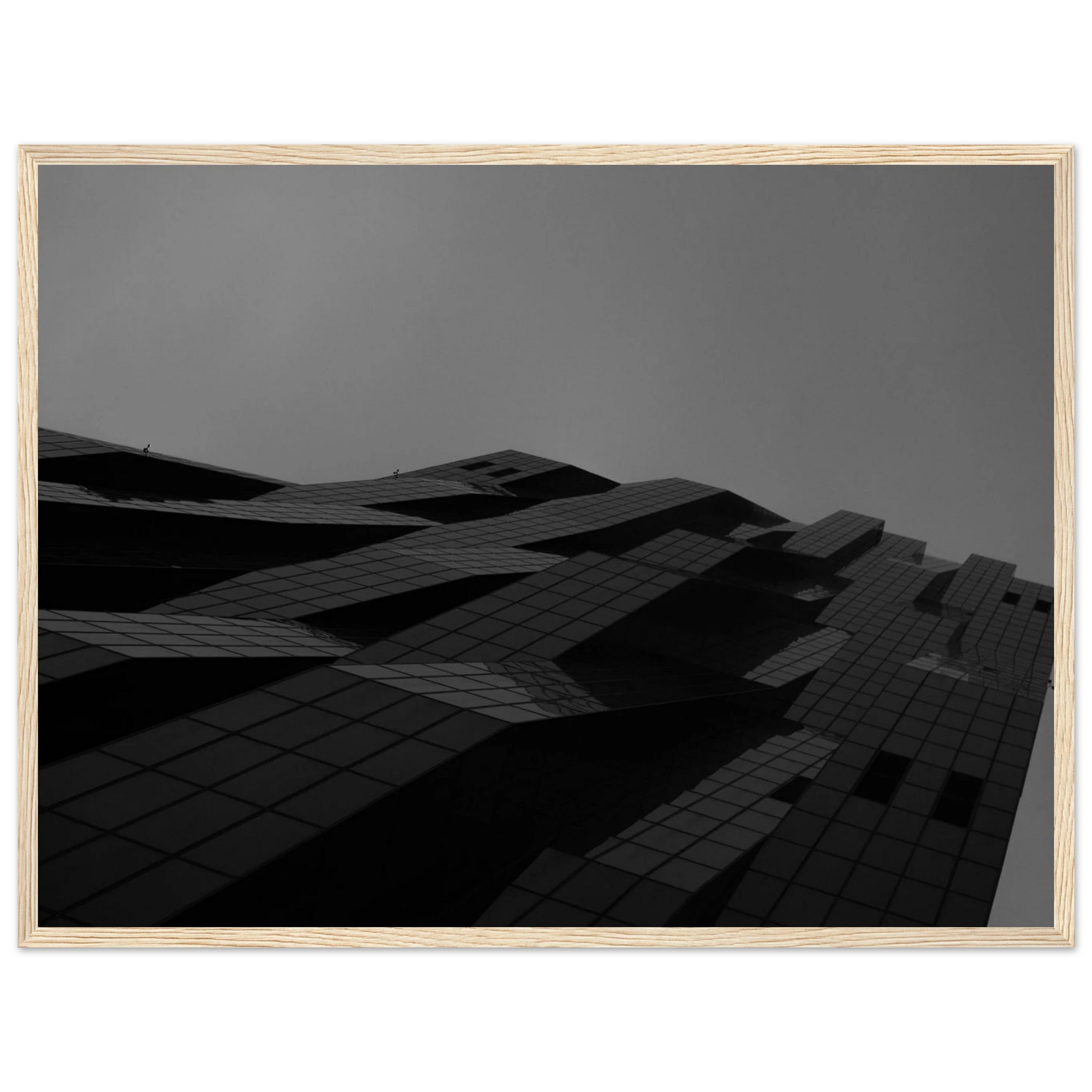 Black and white low angle view of a modern skyscraper with bold geometric lines and dark textured facade on wooden framed wall art