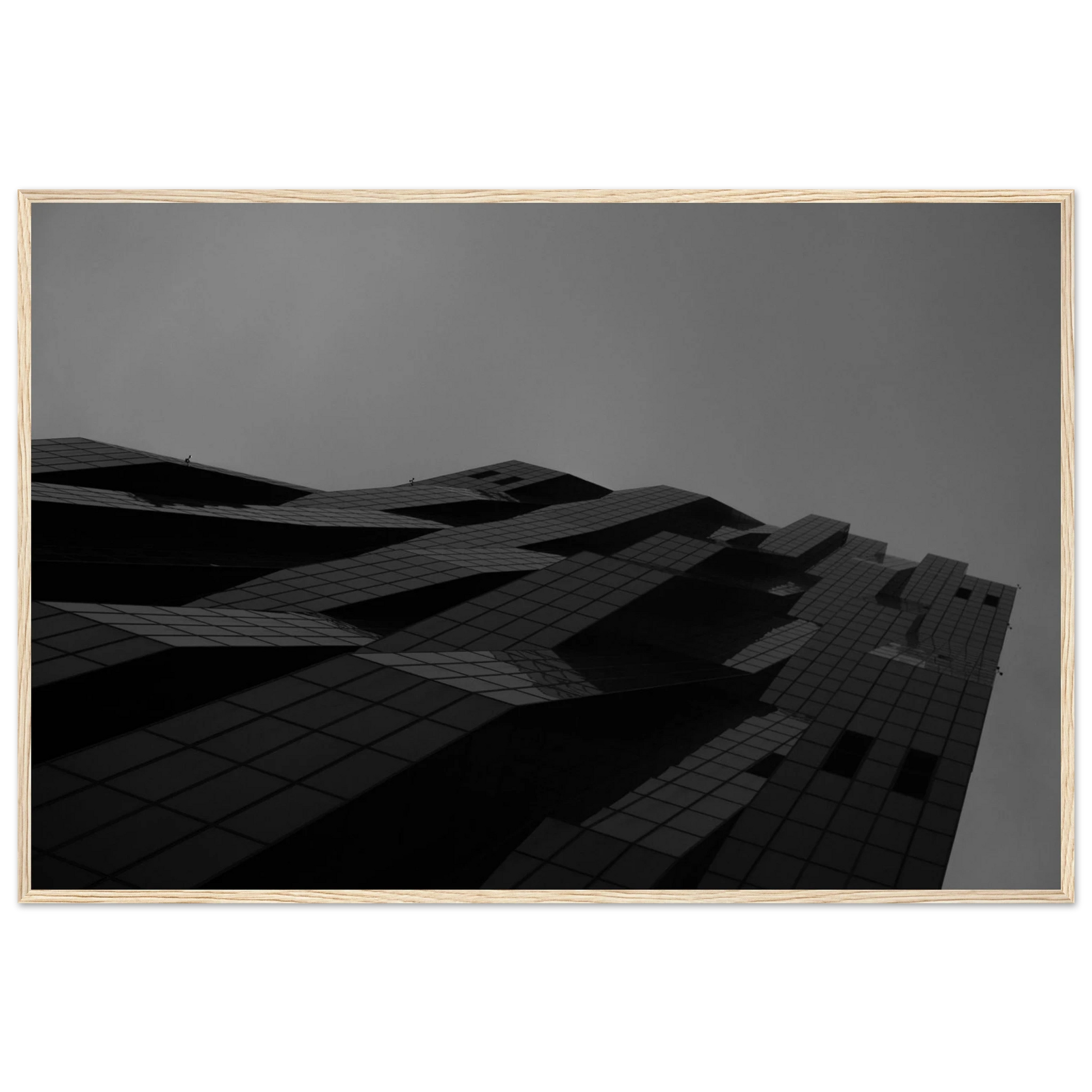 Black and white low angle view of a modern skyscraper with bold geometric lines and dark textured facade on wooden framed wall art