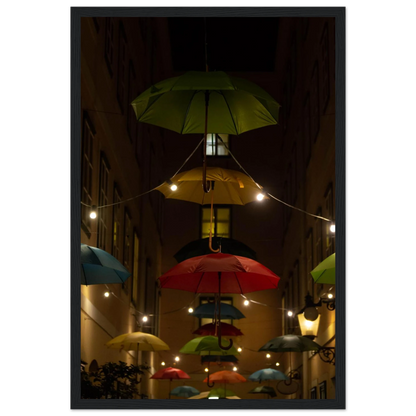 Nighttime street scene with colorful illuminated umbrellas hanging as decoration above a vibrant outdoor area on a wooden frame wall art