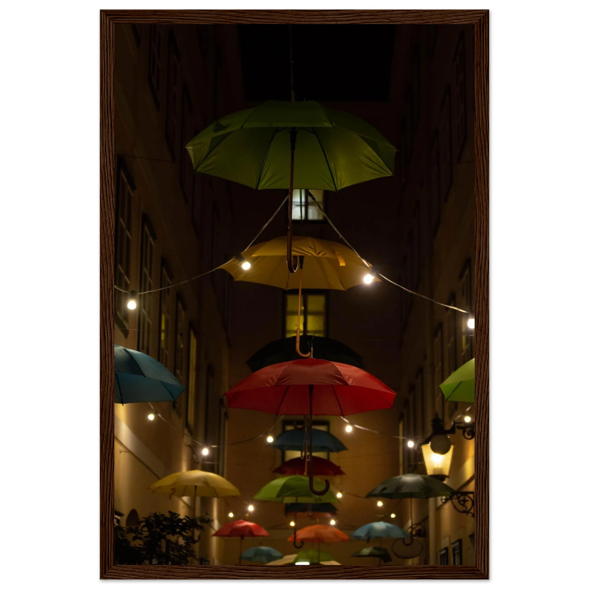 Nighttime street scene with colorful illuminated umbrellas hanging as decoration above a vibrant outdoor area on a wooden frame wall art