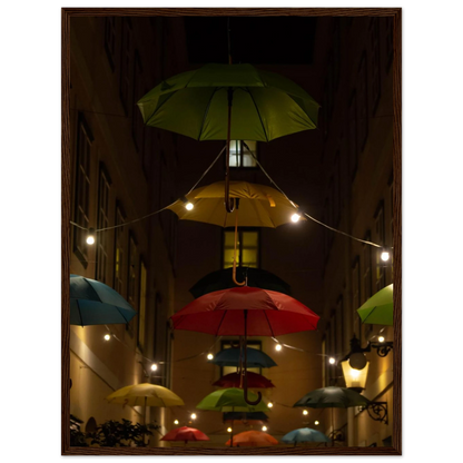 Nighttime street scene with colorful illuminated umbrellas hanging as decoration above a vibrant outdoor area on a wooden frame wall art