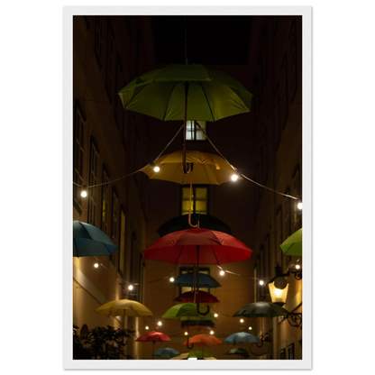 Nighttime street scene with colorful illuminated umbrellas hanging as decoration above a vibrant outdoor area on a wooden frame wall art