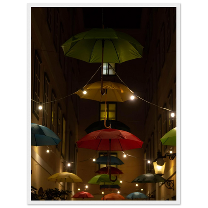Nighttime street scene with colorful illuminated umbrellas hanging as decoration above a vibrant outdoor area on a wooden frame wall art
