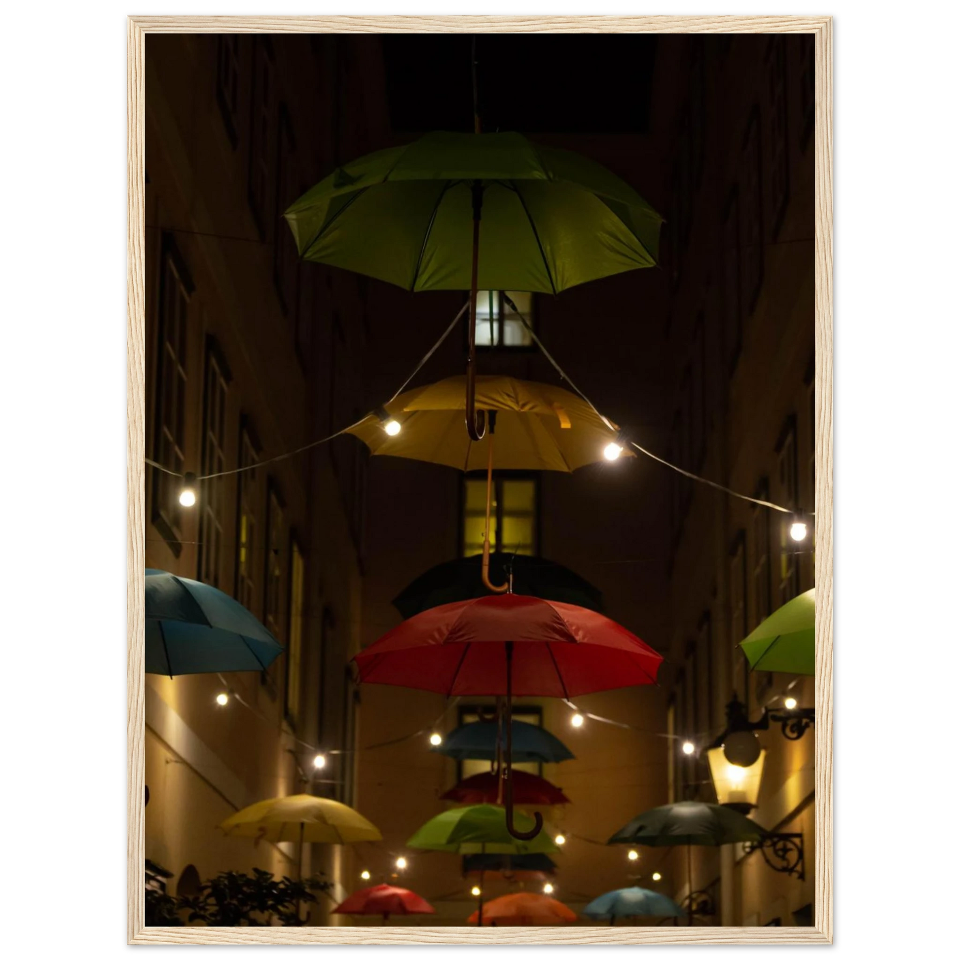 Nighttime street scene with colorful illuminated umbrellas hanging as decoration above a vibrant outdoor area on a wooden frame wall art