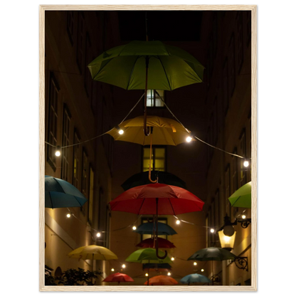 Nighttime street scene with colorful illuminated umbrellas hanging as decoration above a vibrant outdoor area on a wooden frame wall art