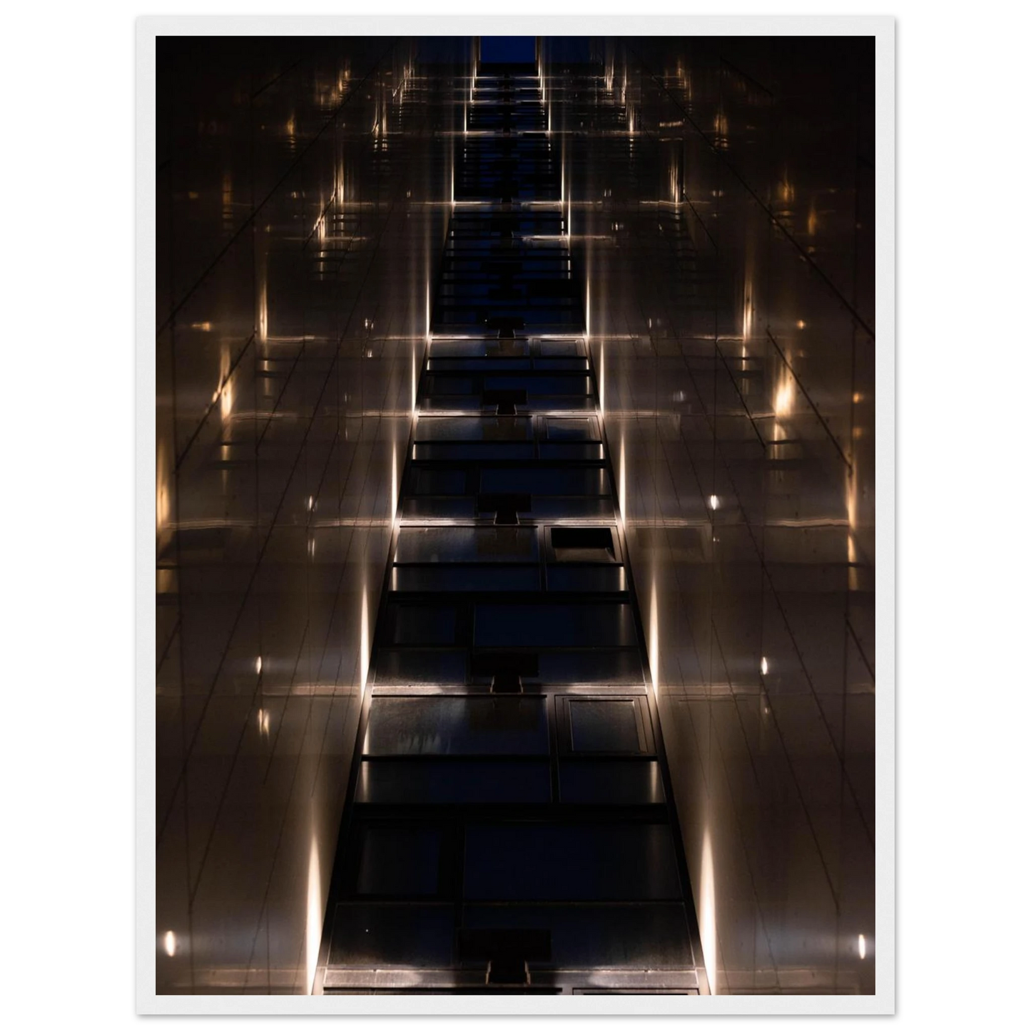Low angle view looking up a narrow corridor-like passage between two skyscraper walls lined with rows of windows stretching toward the sky on wooden framed wall art