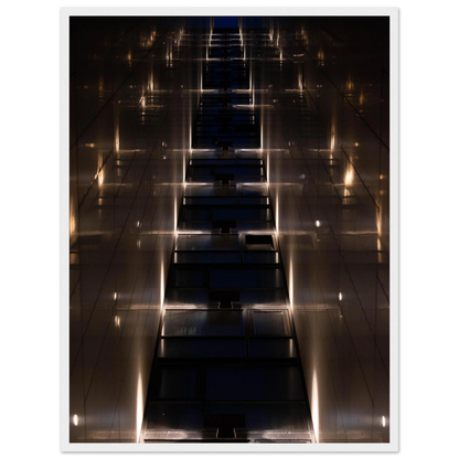 Low angle view looking up a narrow corridor-like passage between two skyscraper walls lined with rows of windows stretching toward the sky on wooden framed wall art