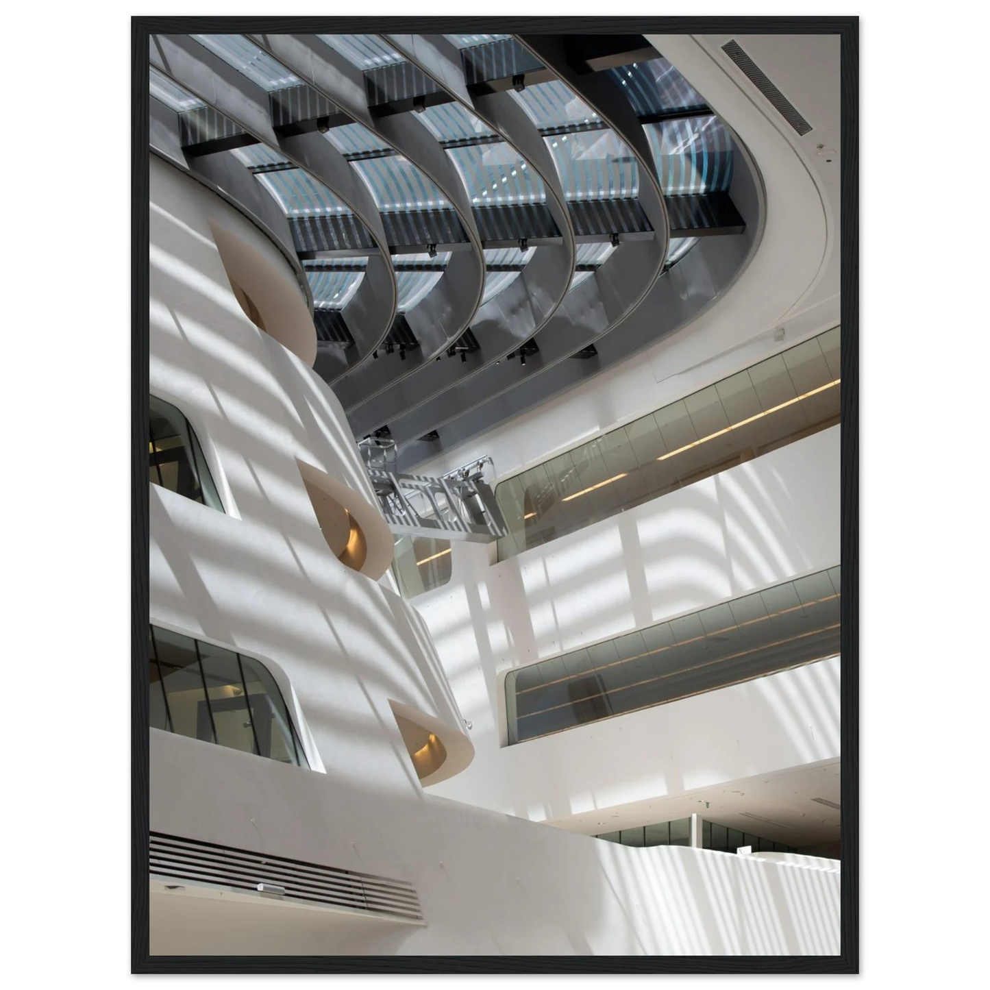 Interior view of the Library of WU (Vienna University of Economics and Business) on wooden frame wall art featuring modern architecture with multiple floors and open study spaces