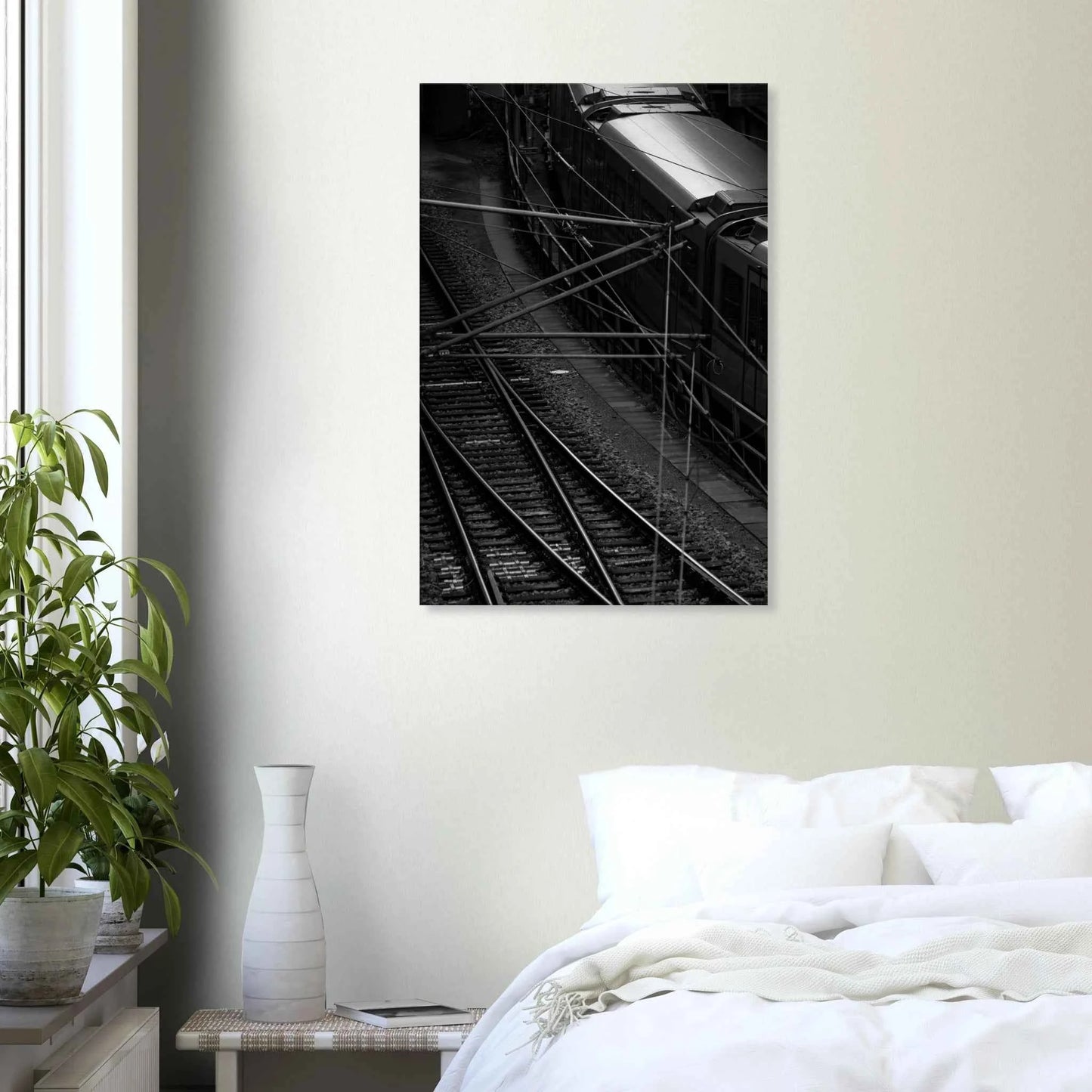 Black and white aerial view of metro train and railway tracks in an urban underground or elevated rail system on Canvas Print wall art on the wall in the Bedroom