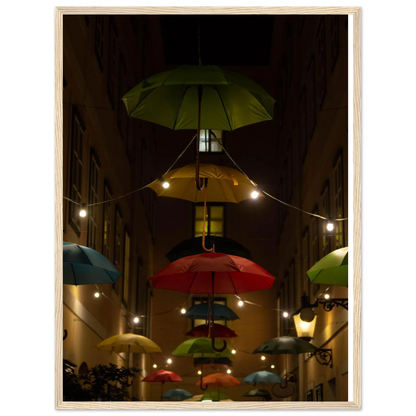 Nighttime street scene with colorful illuminated umbrellas hanging as decoration above a vibrant outdoor area on a wooden frame wall art