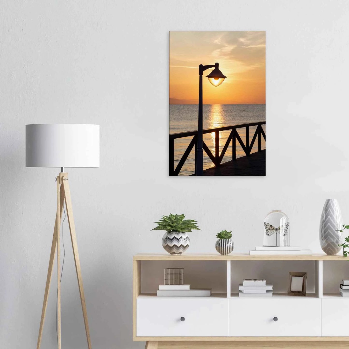 Canvas print wall art of a sunset over the sea with a street lamp on the pier on the wall in the Livingroom