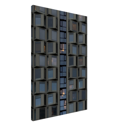 Close up view of a modern building facade with a grid of reflective glass windows on Canvas print wall art