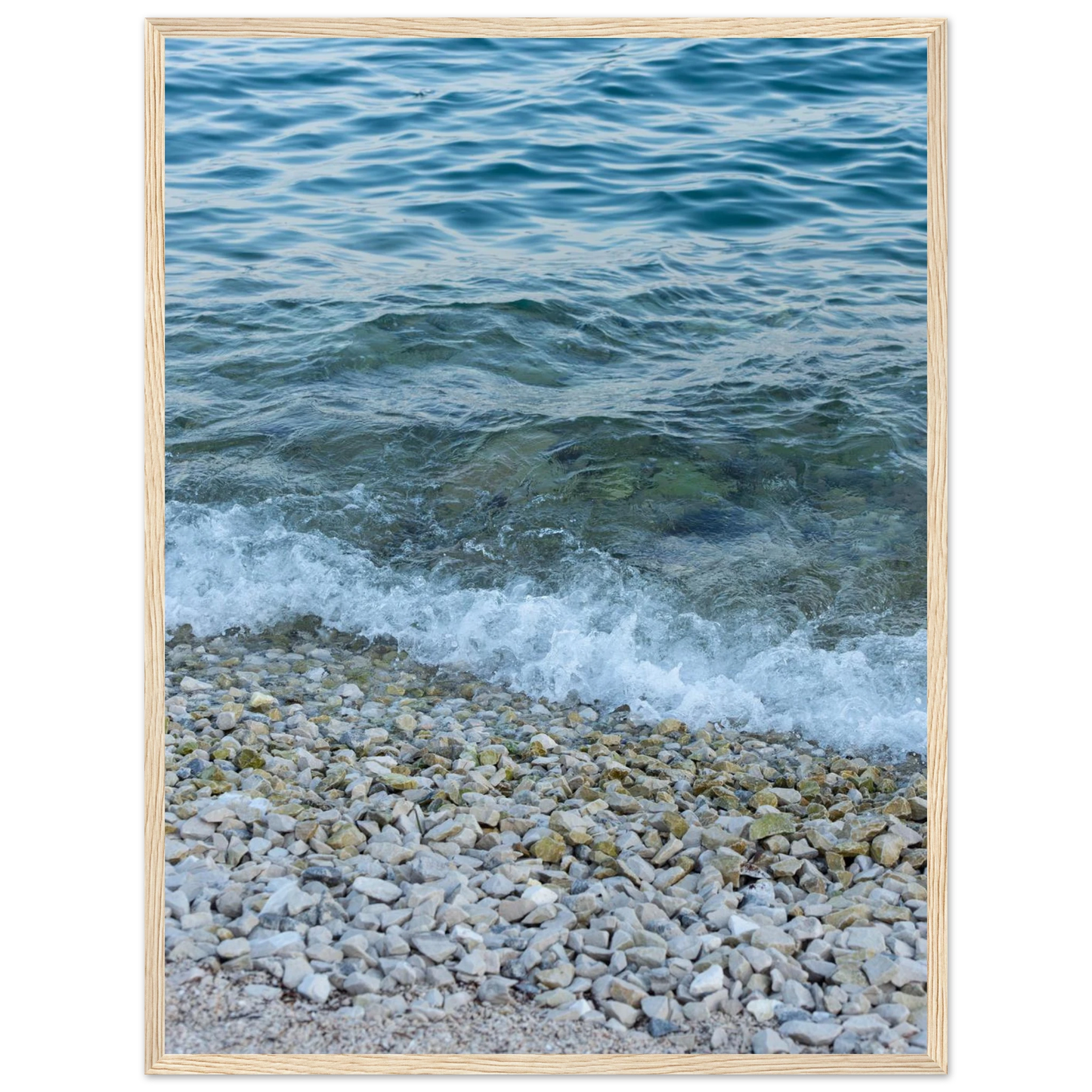 Aerial view ocean beach with wood frame, top down drone shot of blue sea foam and pebbles