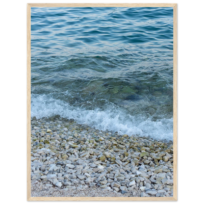 Aerial view ocean beach with wood frame, top down drone shot of blue sea foam and pebbles