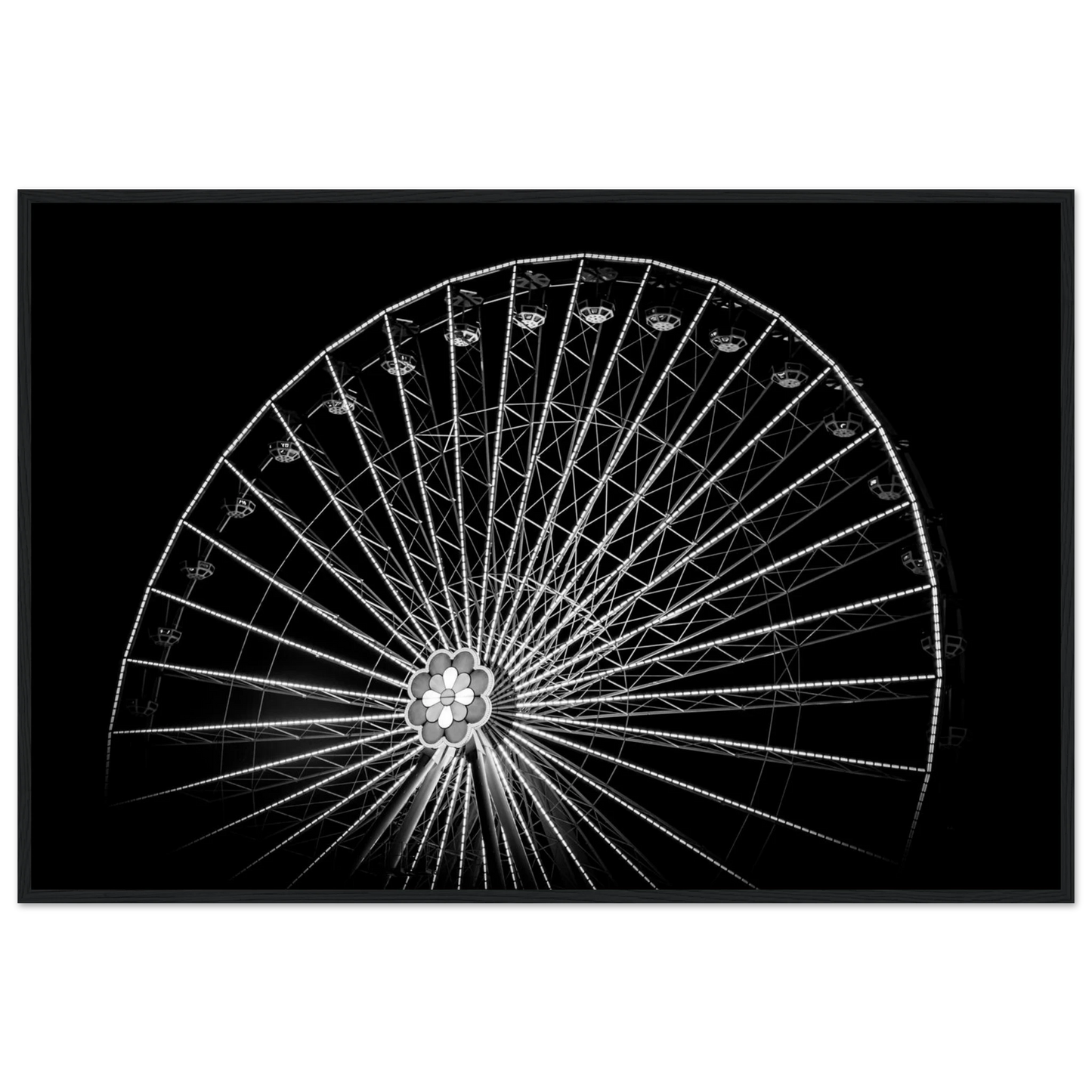 Black and white night photo of the Vienna Prater Giant Ferris Wheel (Wiener Riesenrad) with illuminated spokes forming a circular pattern against the dark sky on wooden framed wall art