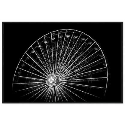 Black and white night photo of the Vienna Prater Giant Ferris Wheel (Wiener Riesenrad) with illuminated spokes forming a circular pattern against the dark sky on wooden framed wall art