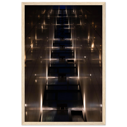 Low angle view looking up a narrow corridor-like passage between two skyscraper walls lined with rows of windows stretching toward the sky on wooden framed wall art
