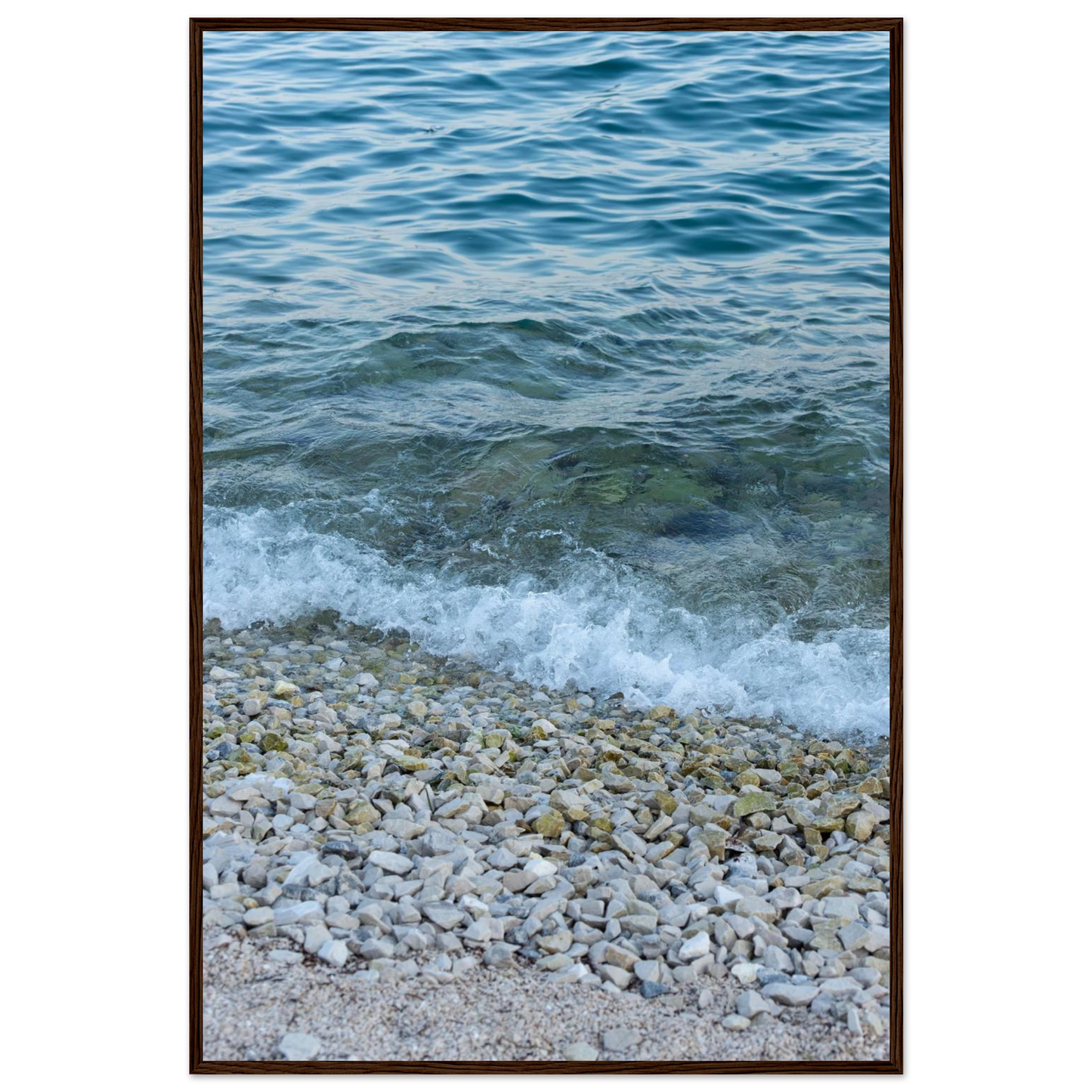 Aerial view ocean beach with wood frame, top down drone shot of blue sea foam and pebbles