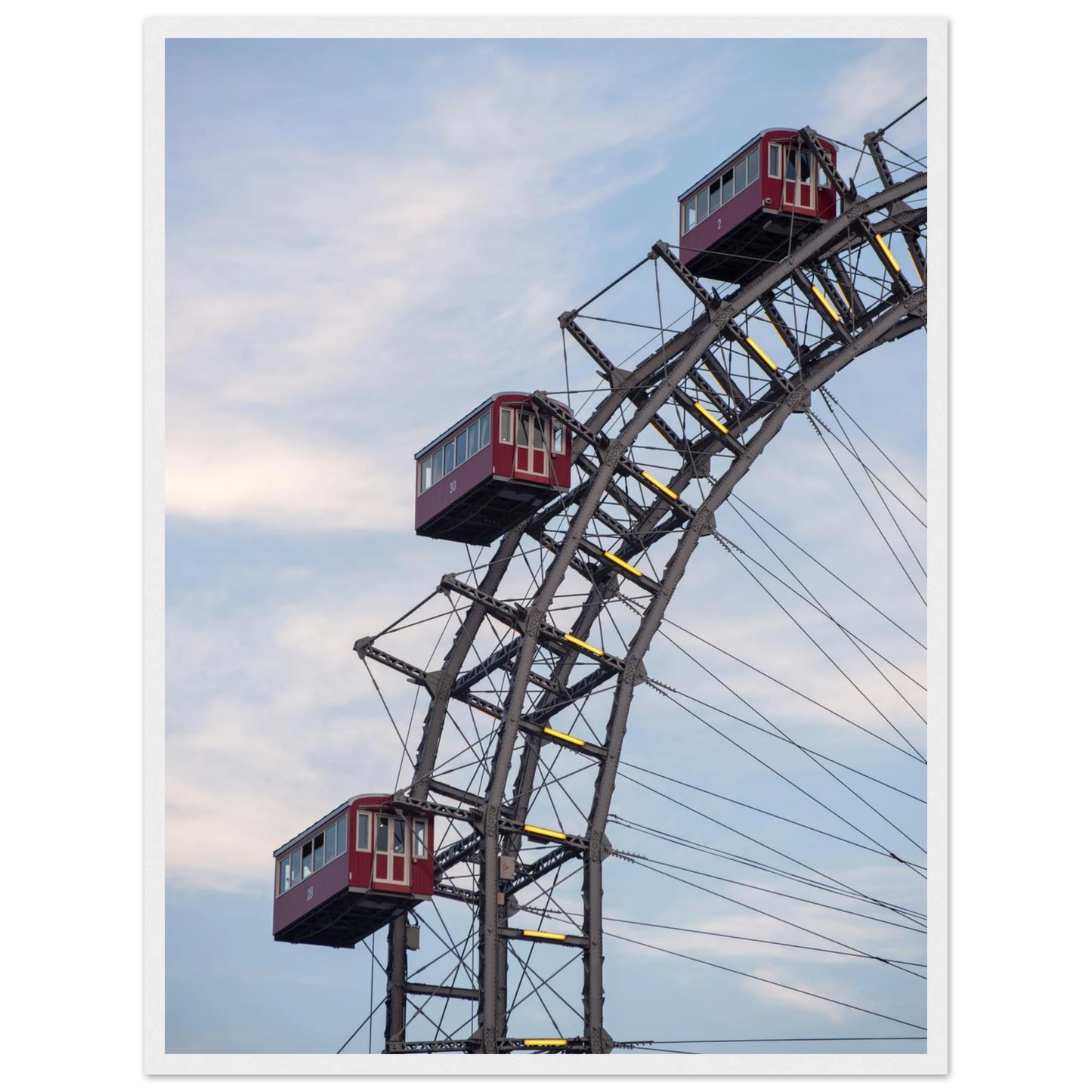 Close up of the historic Vienna Prater Giant Ferris Wheel (Wiener Riesenrad) showing its iconic steel structure and vintage mechanical details on wooden framed wall art