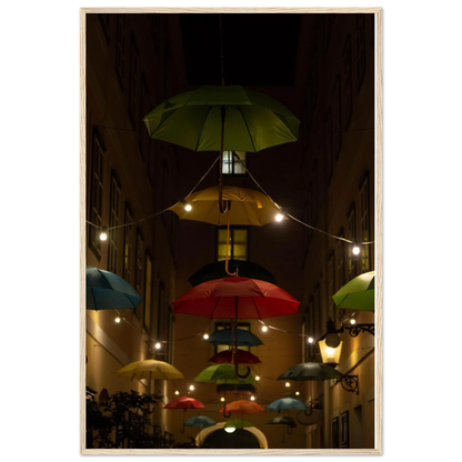Nighttime street scene with colorful illuminated umbrellas hanging as decoration above a vibrant outdoor area on a wooden frame wall art