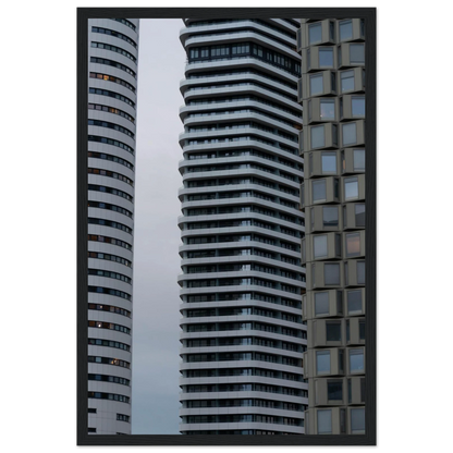 Modern high rise tower buildings with glass and steel facade reaching into the sky on wodden framed wall art