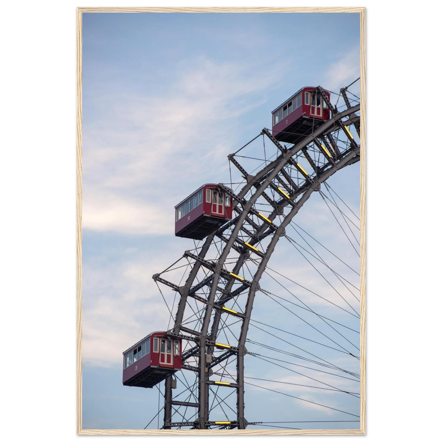 Close up of the historic Vienna Prater Giant Ferris Wheel (Wiener Riesenrad) showing its iconic steel structure and vintage mechanical details on wooden framed wall art