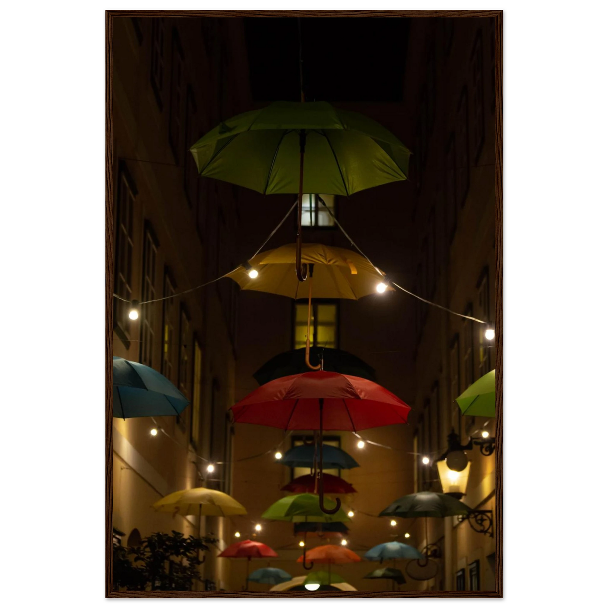 Nighttime street scene with colorful illuminated umbrellas hanging as decoration above a vibrant outdoor area on a wooden frame wall art