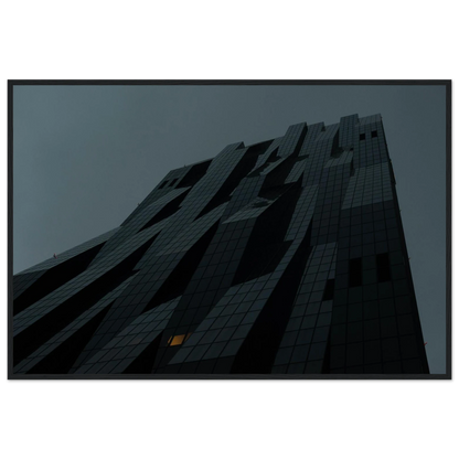 Bluish low angle view of a modern skyscraper with bold geometric lines and dark textured facade on Wooden framed wall art
