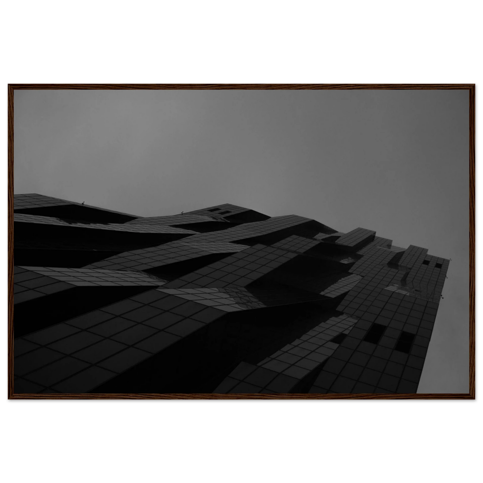 Black and white low angle view of a modern skyscraper with bold geometric lines and dark textured facade on wooden framed wall art